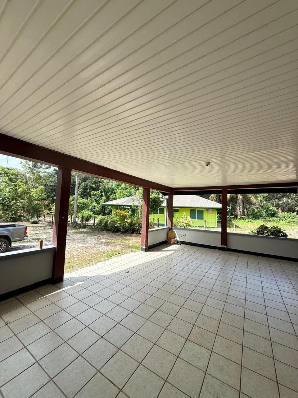 Spacious tiled veranda with garden view